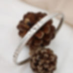 Handmade sterling silver bangle with a brushed finish