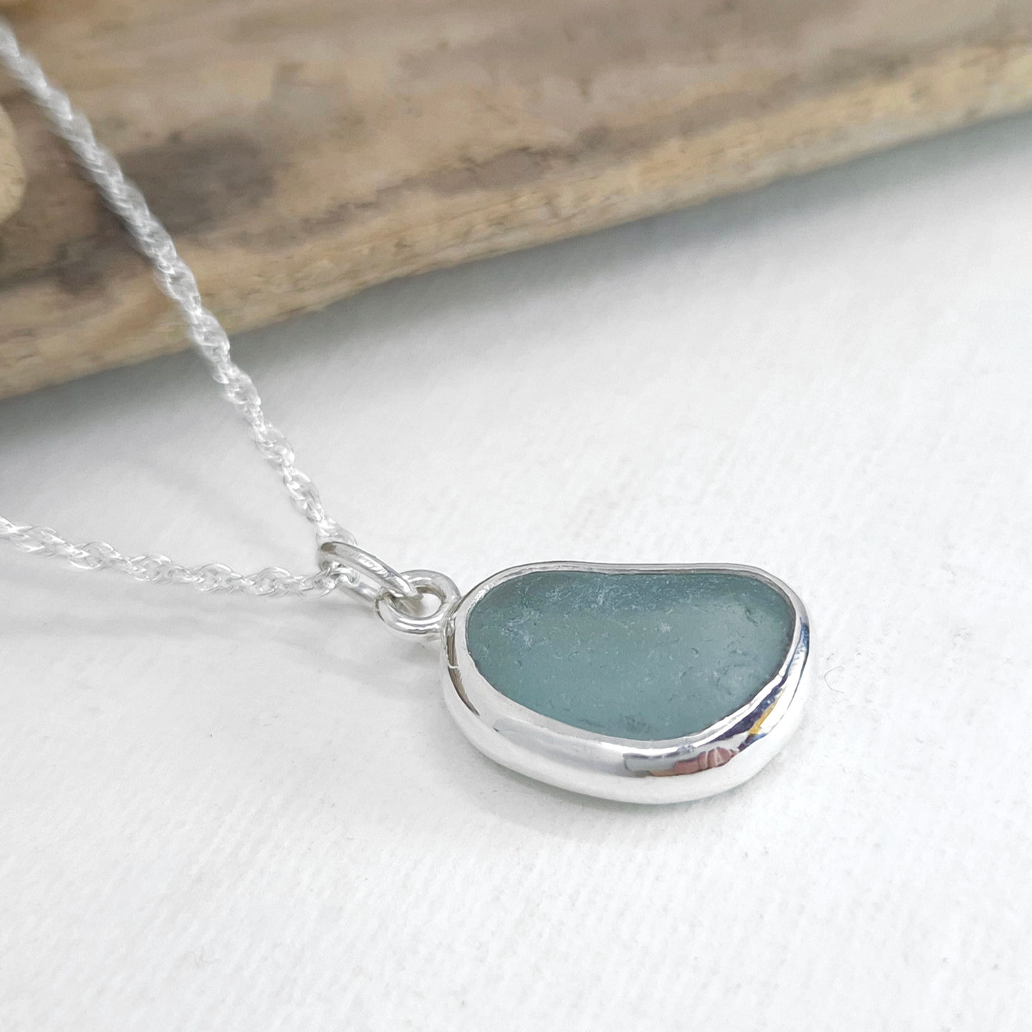 Aqua blue Seaham sea glass necklace in a handmade sterling silver bezel