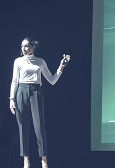 Woman presenting in focused light representing awareness and mindset and the Energy Leadership Index Assessment ELI