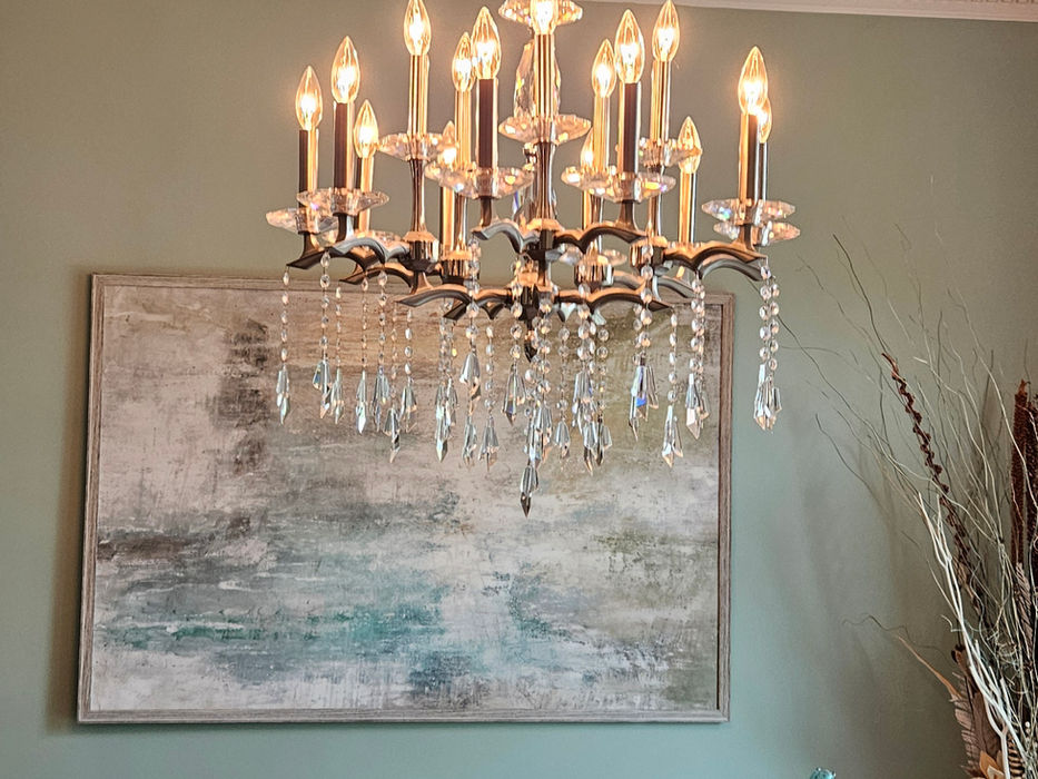 Crystal chandelier hanging above a dining table