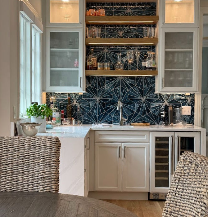 Home wet bar with blue backsplash and wine cooler