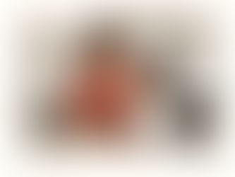 Toddler eating in the kitchen with mom.