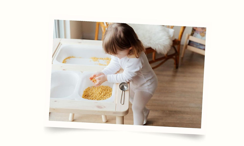 Toddler playing with sensory toy.