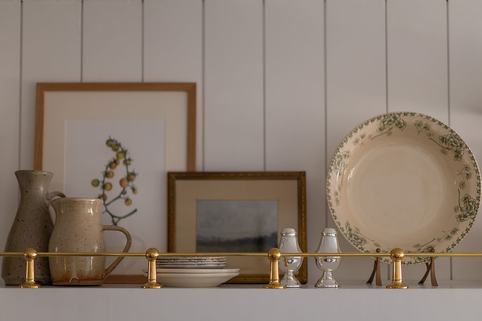 brass rail on open shelving with vintage decor