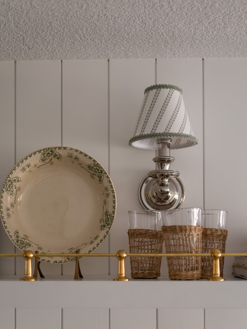 polished silver sconce with brass wall