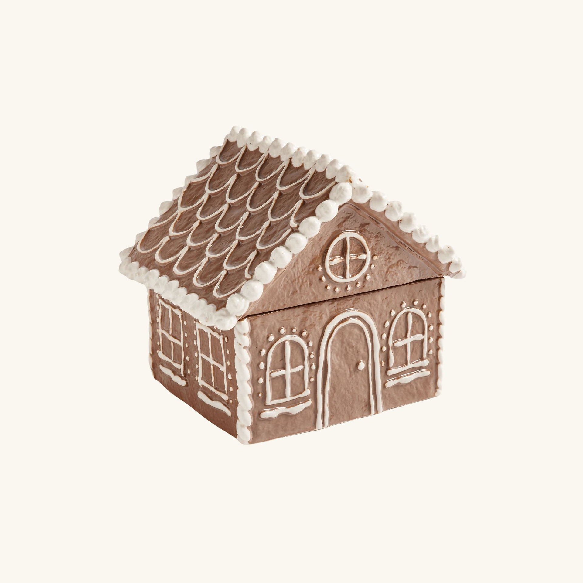 gingerbread house with white piped icing