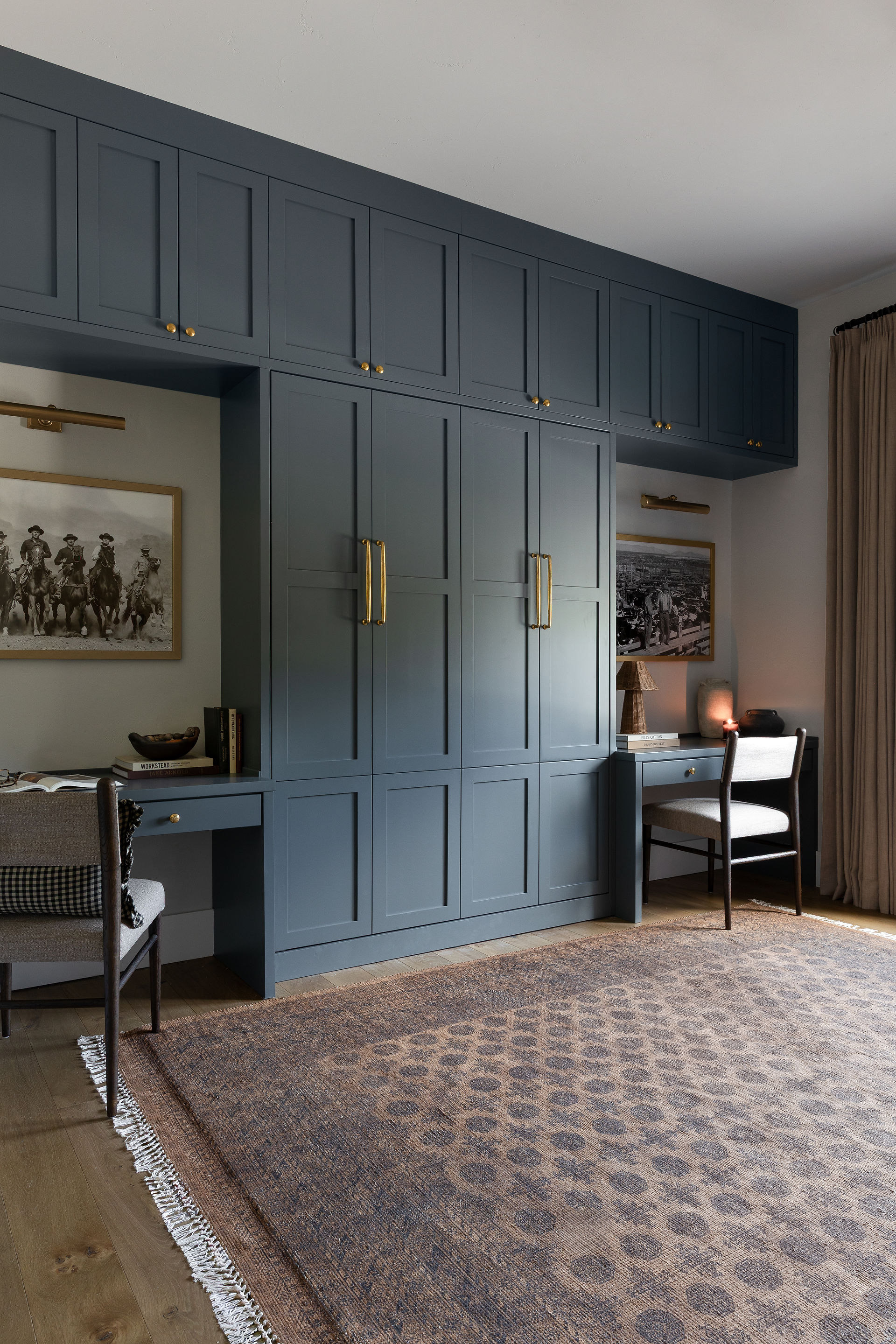 Lake Travis guest bedroom and home office with custom Murphy bed and built-in cabinetry by Audrey Scheck Design