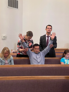 CMI Connect group leaders praying over Student