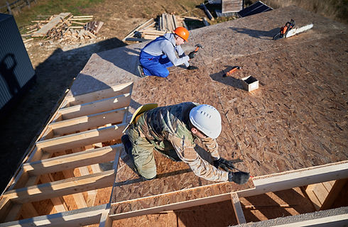 carpenter-hammering-nail-into-osb-panel-while-buil-2023-11-27-04-50-56-utc.jpg