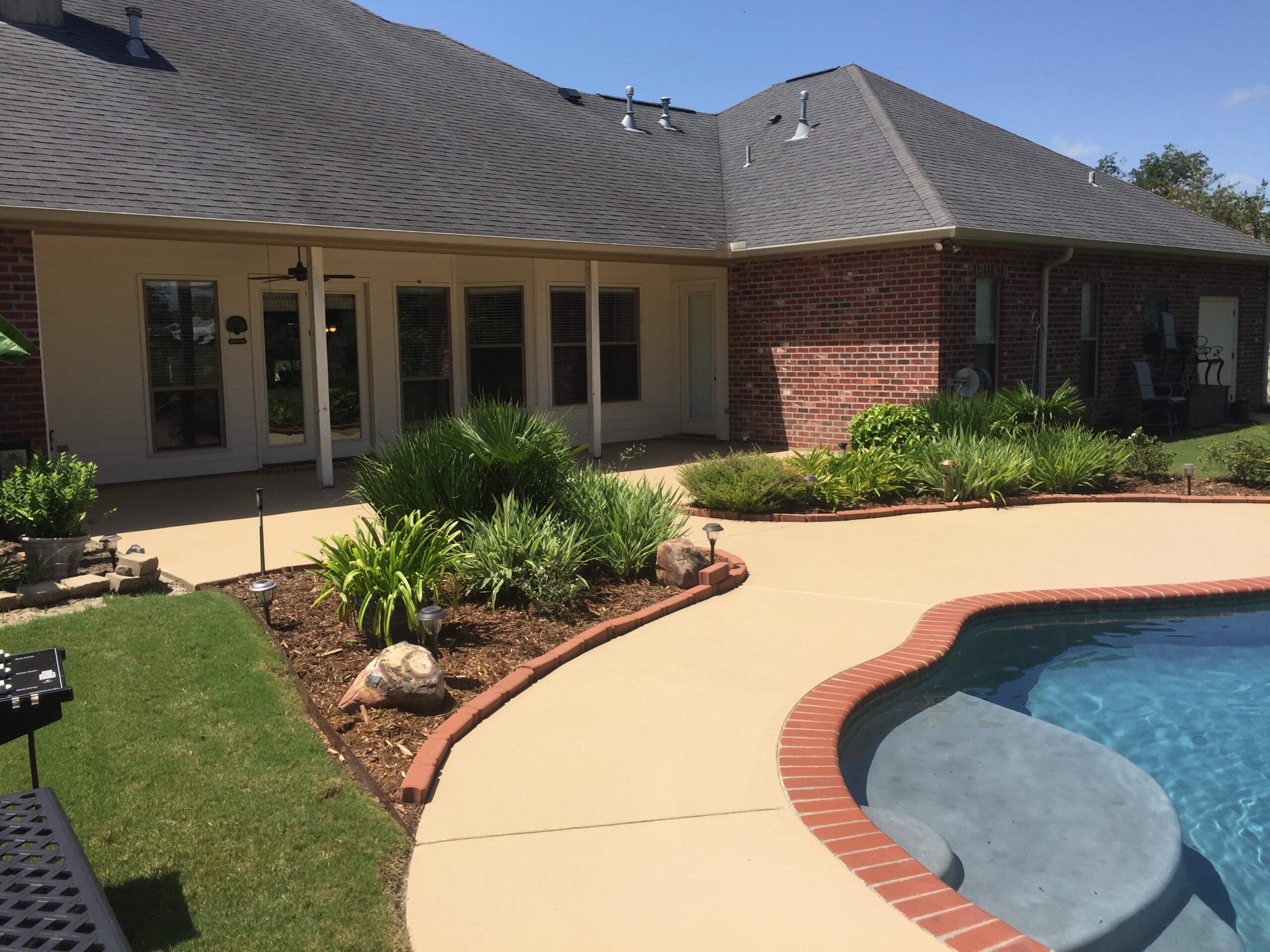 Decorative concrete pool deck by Rockwood Custom Concrete
