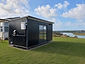 Moving Spaces Standard (3.6m x 2.4m) portable cabin being rented, positioned on a residential property
