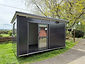 Moving Spaces Standard (3.6m x 2.4m) portable cabin being rented, positioned on a residential property