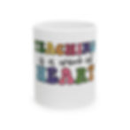 Front of the teaching is a work of heart mug with its bright letting and simple design.