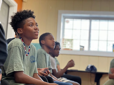 Center 360 youth listening and smiling