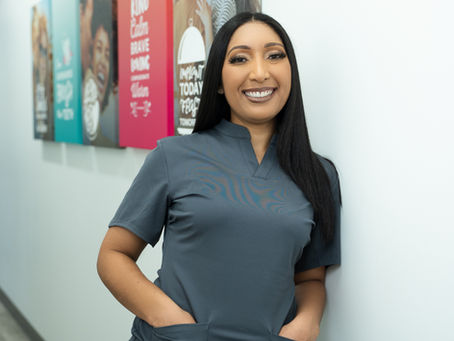 Collena Robertson, DMD, in Ourz Scrubs with her hands in the front pockets, showing the neckline and the drape of the rayon, nylon and spandex fabric.
