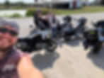 Motorcyclist family with motorcycles