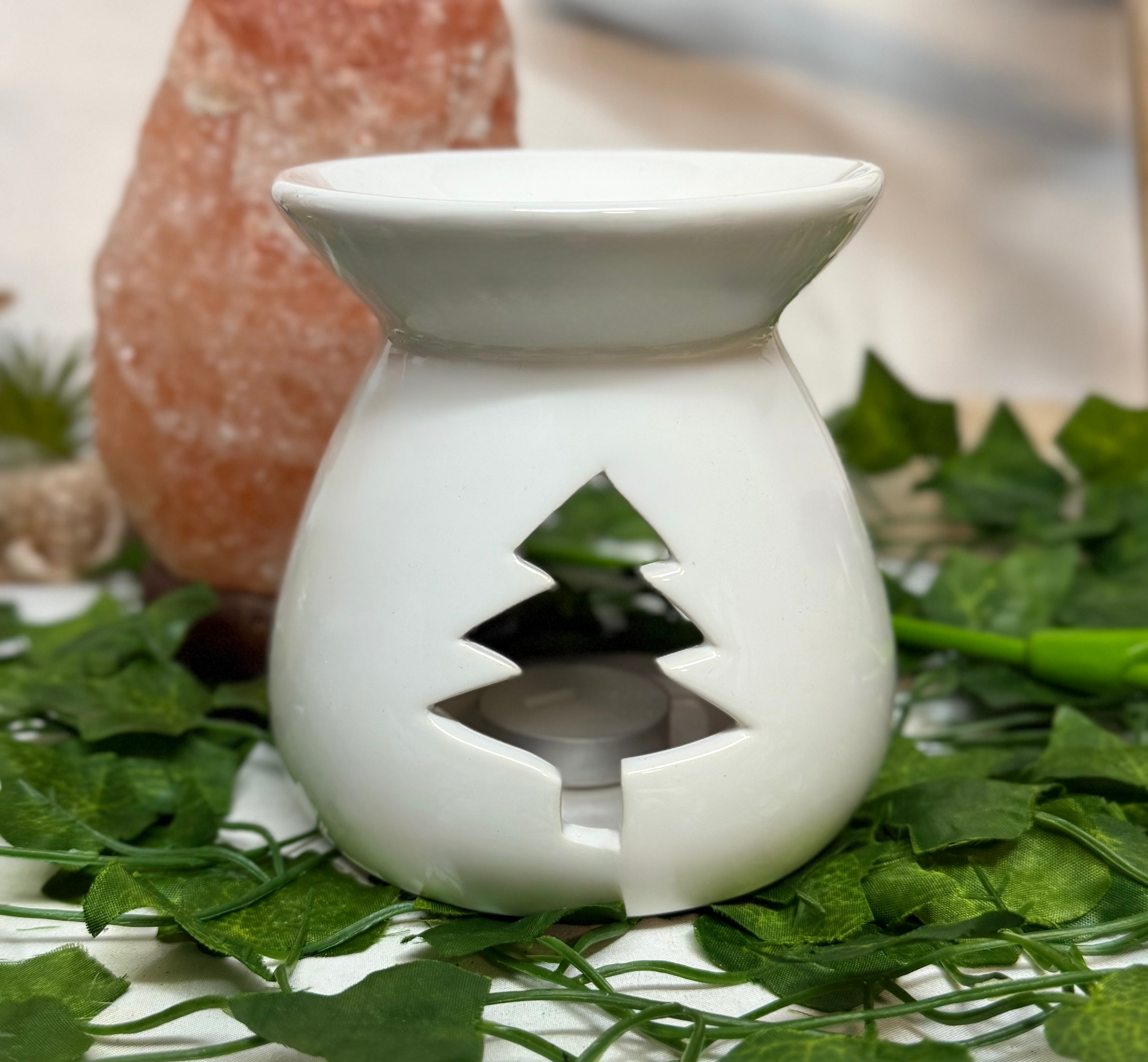 Oil and wax melt burner showcasing a tree on the front carved out