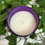 Thumbnail: Top of candle with purple glass jar and white coloured wax