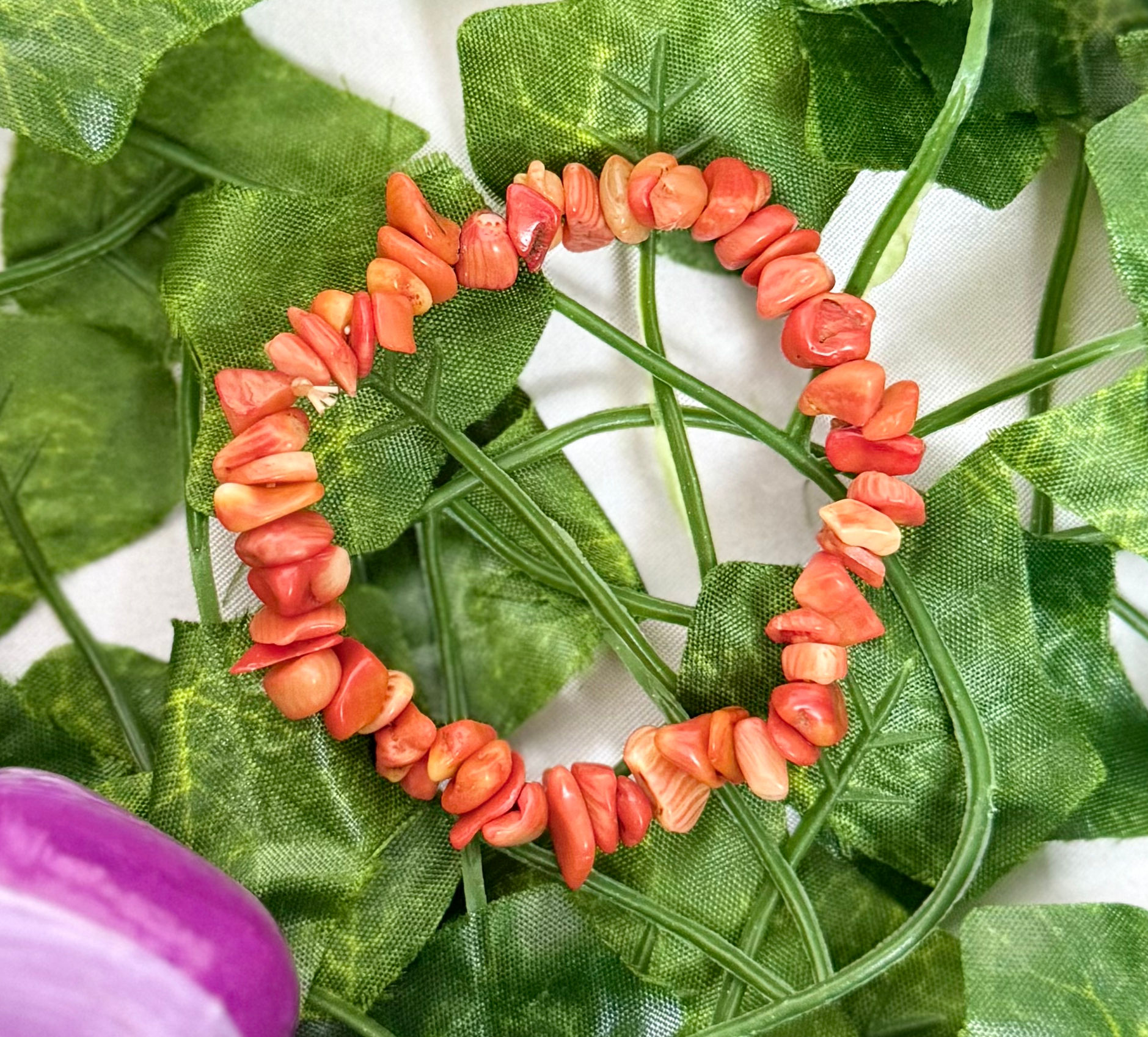 Corallite Chip Stone Bracelet on Vine Background