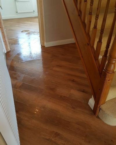 Wooden floor hallway with staircase