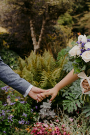 beautiful photo of couple holding hands on wedding day