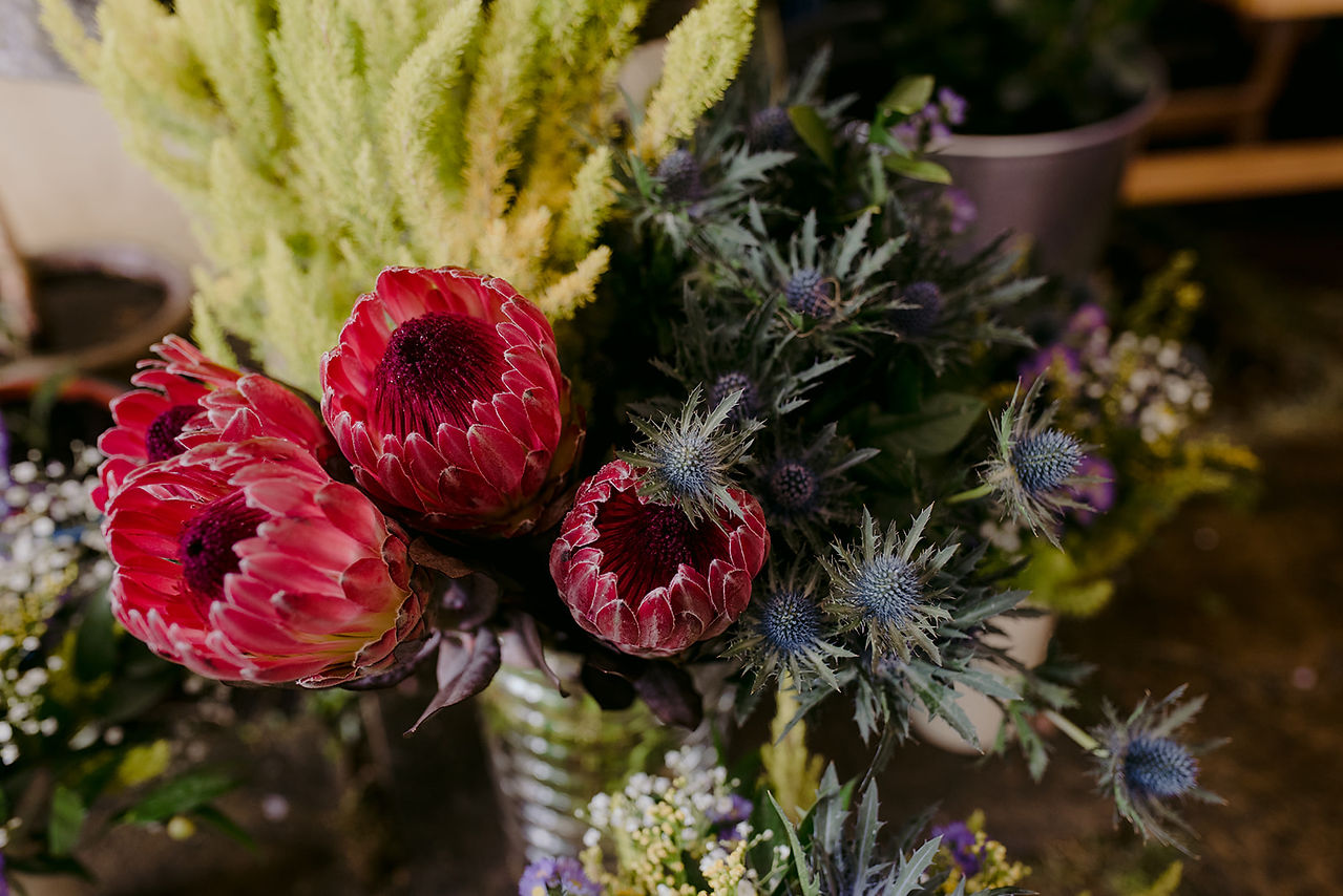 wedding flowers in tin cans