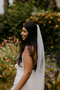 candid photo of Indian bride with veil