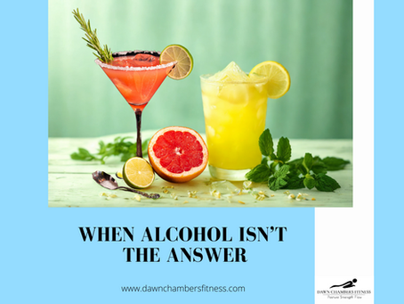 Two cocktails on a green table with citrus fruits and mint. Text: "When Alcohol Isn’t the Answer." Logo and website at bottom.