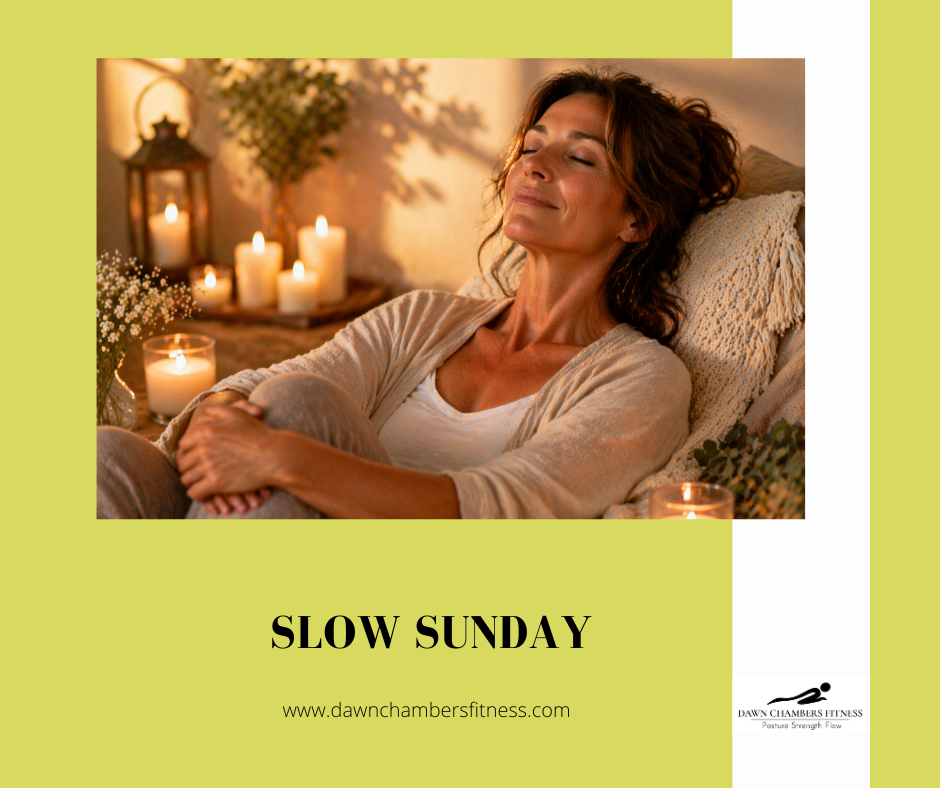 Woman relaxes with closed eyes in candlelit room. Text: "SLOW SUNDAY" and website link. Cozy, serene atmosphere.
