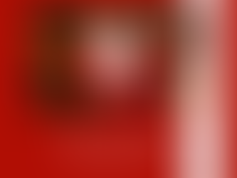 Father Christmas waving by a christmas tree