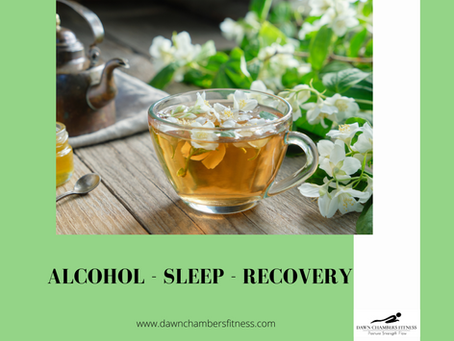 A glass cup of herbal tea with flowers on a wooden table, teapot and spoon nearby, surrounded by white blossoms. Text: "ALCOHOL - SLEEP - RECOVERY".