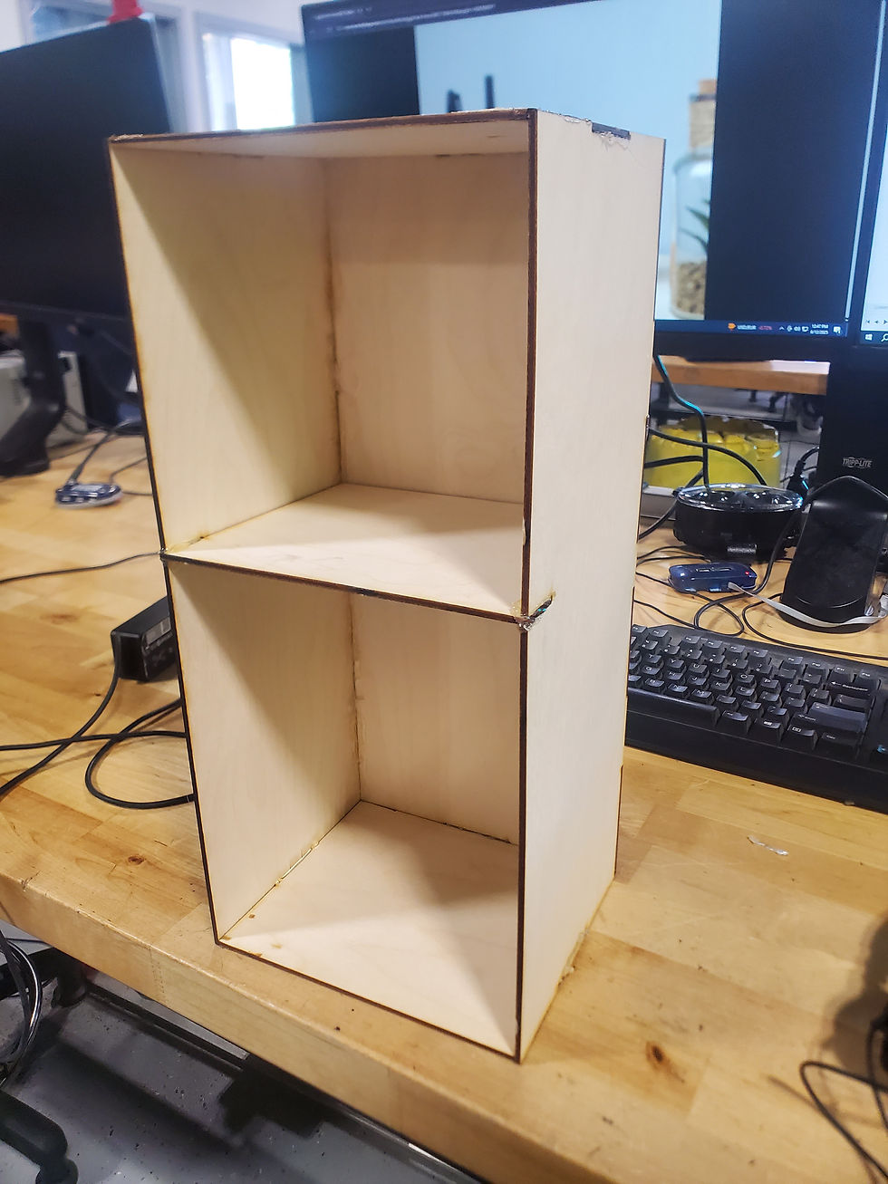 The bookshelf w/ its final wooden pieces