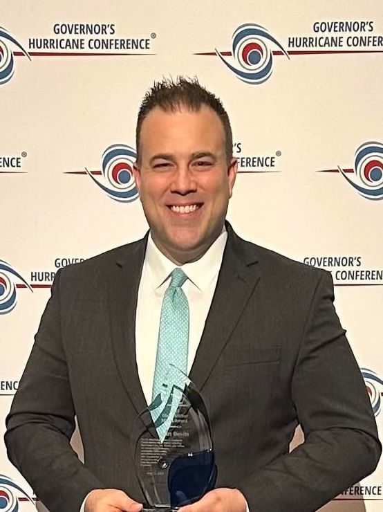 Matt Devitt accepting the Tropical Weather Media Award at the Governor’s Hurricane Conference. Courtesy Facebook