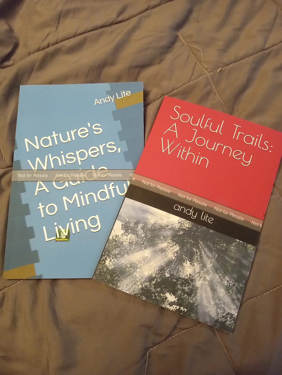 two books laying on a bed