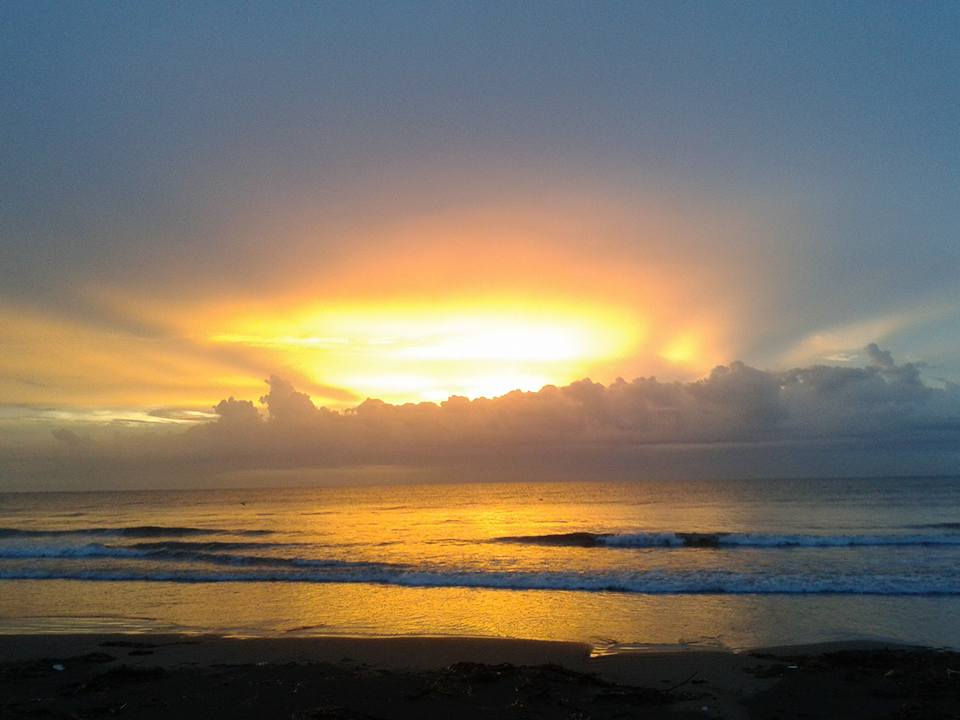 a sunset off the beach