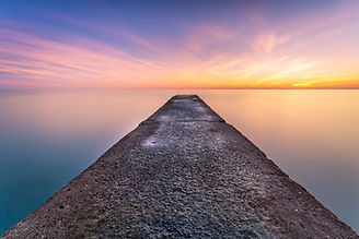 Jetée de l'Île de Ré en pose longue au coucher du soleil — photographie de paysage par Benjamin Mineau