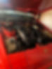 Engine bay of a classic car, likely a sports model