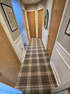 Tartan plaid patterned carpet fitted in a modern hallway with paneled walls