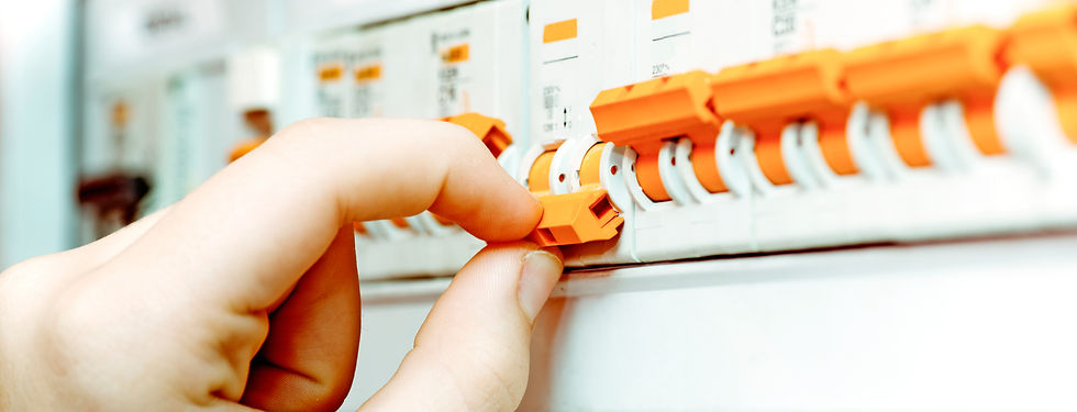 Hand resetting a trip switch on a consumer unit board