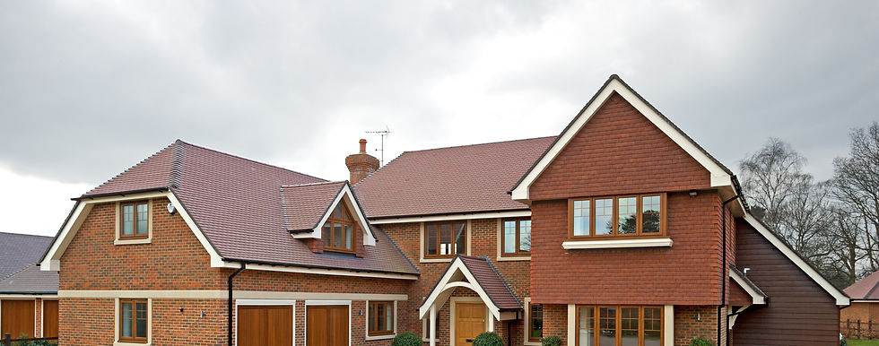 A large house with a spacious driveway and a parked car in front