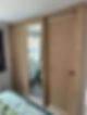 Wooden wardrobe doors reflecting mirror