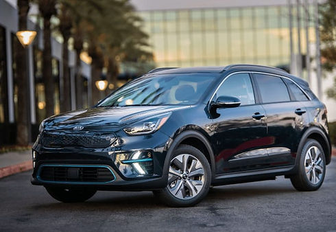 A KIA car parked near some buildings