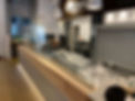 Modern fishmonger shop interior with wooden counter