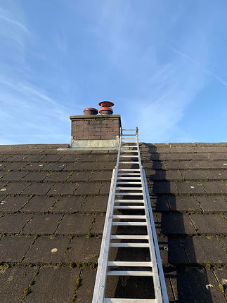 Ladder leading to rooftop chimney