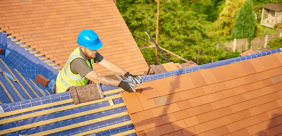 A construction worker in a blue helmet and yellow vest installs