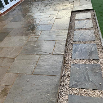 Natural stone pathway with gravel drainage channel