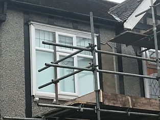 Construction team installing external wall insulation system