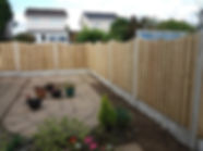 Timber fence with concrete posts