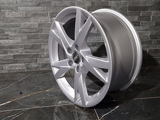 Clean silver alloy wheel rim presented after specialist refurbishment