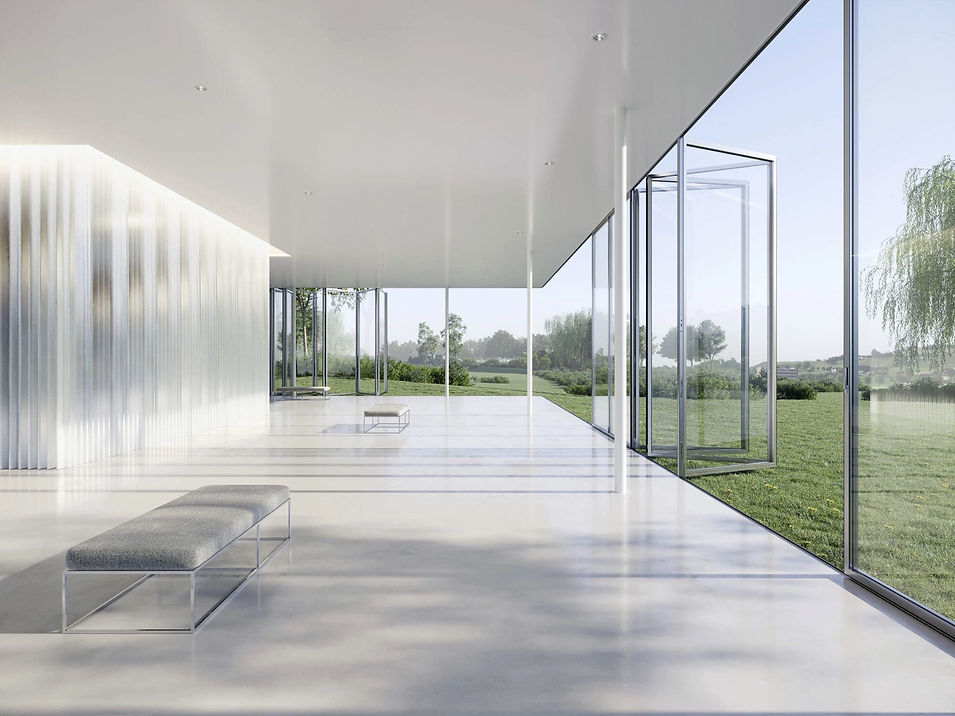 Bright open-plan room with floor-to-ceiling glass bi-fold doors overlooking green garden landscape